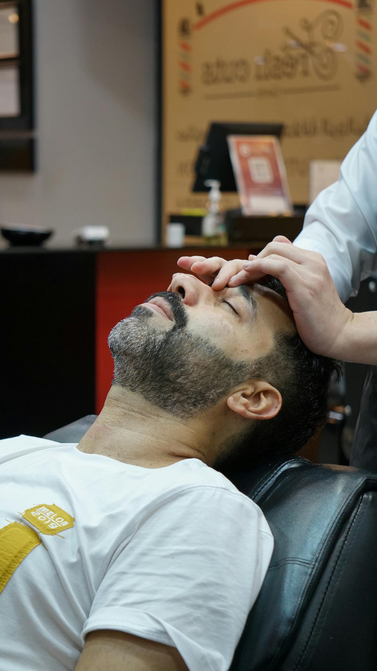 Man enjoying a skincare treatment at a salon. Relaxing and professional atmosphere captured.